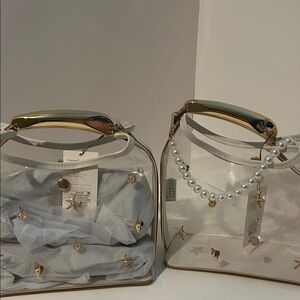 A New Day Clear beach Bag with Gold Trim  with pearl bag charm